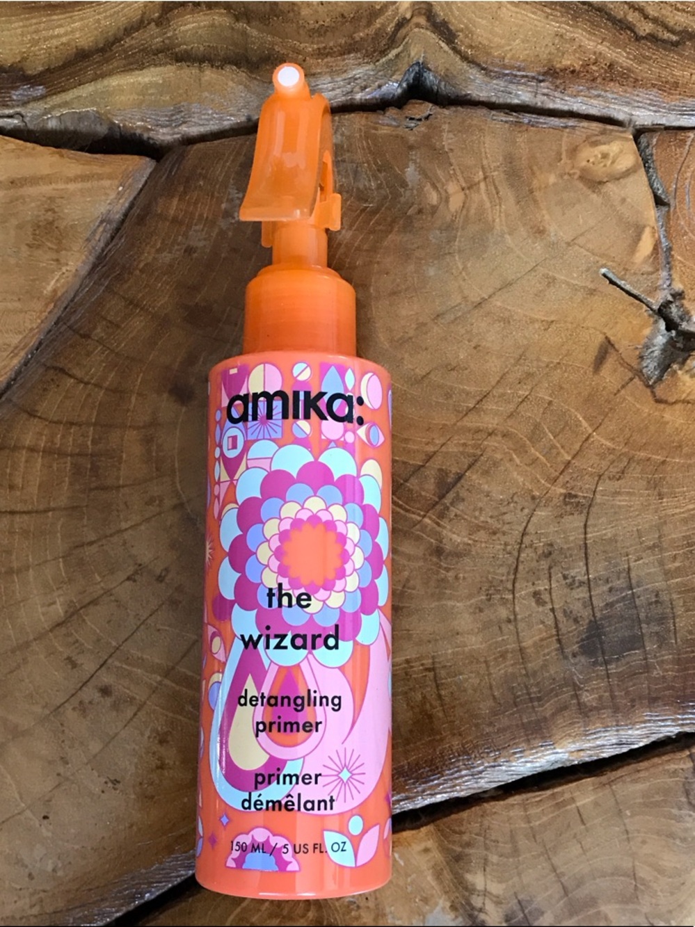 amika The Wizard Detangling Primer - Orange & Pink Floral Bottle